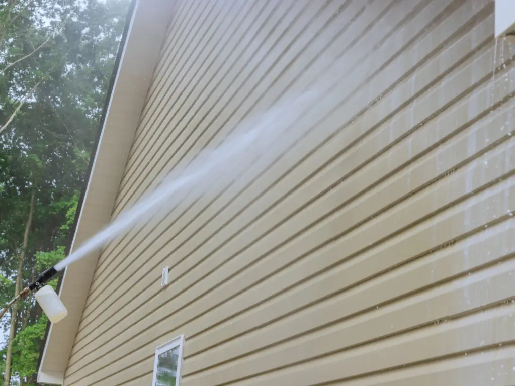 Professional home siding power washing service in Collingswood, NJ — removing algae, mold, and years of grime from painted wood and vinyl exterior siding.